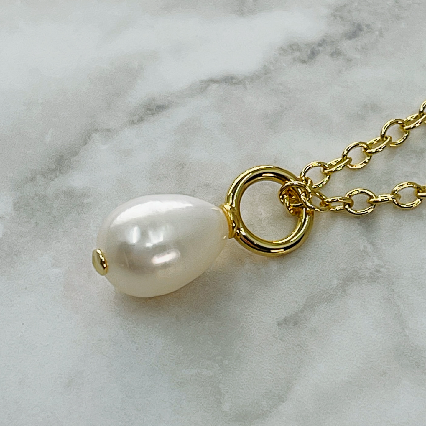 White freshwater pearl charm
