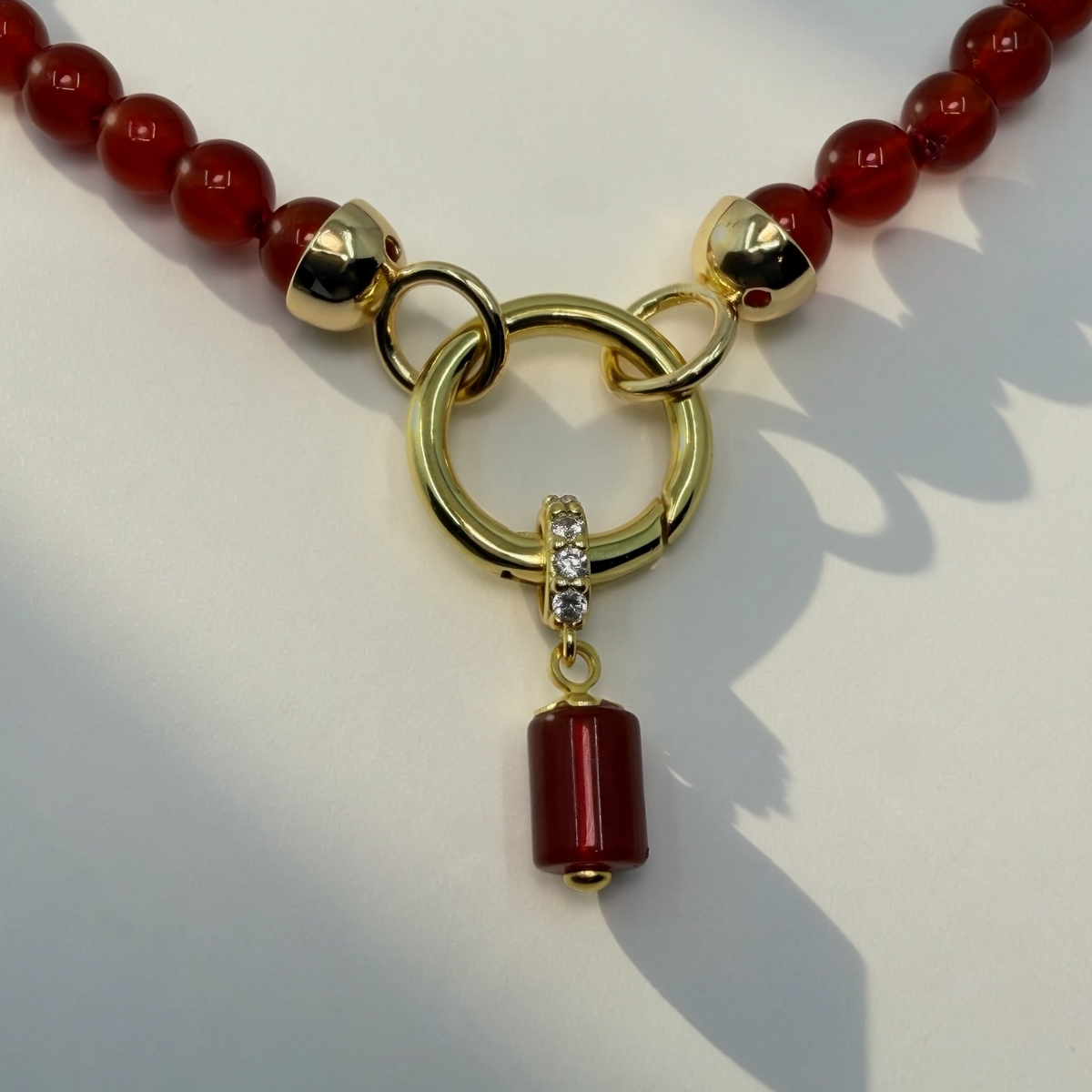 CARDINALE gold and carnelian hand-knotted necklace with charm