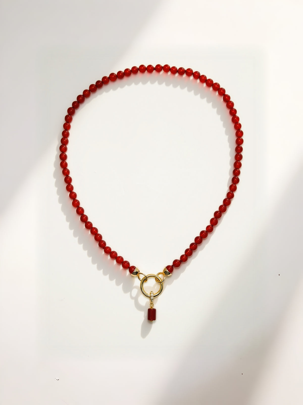 CARDINALE gold and carnelian hand-knotted necklace with charm