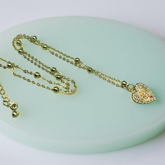 CELESTE gold sunburst heart pendant with gold satellite chain