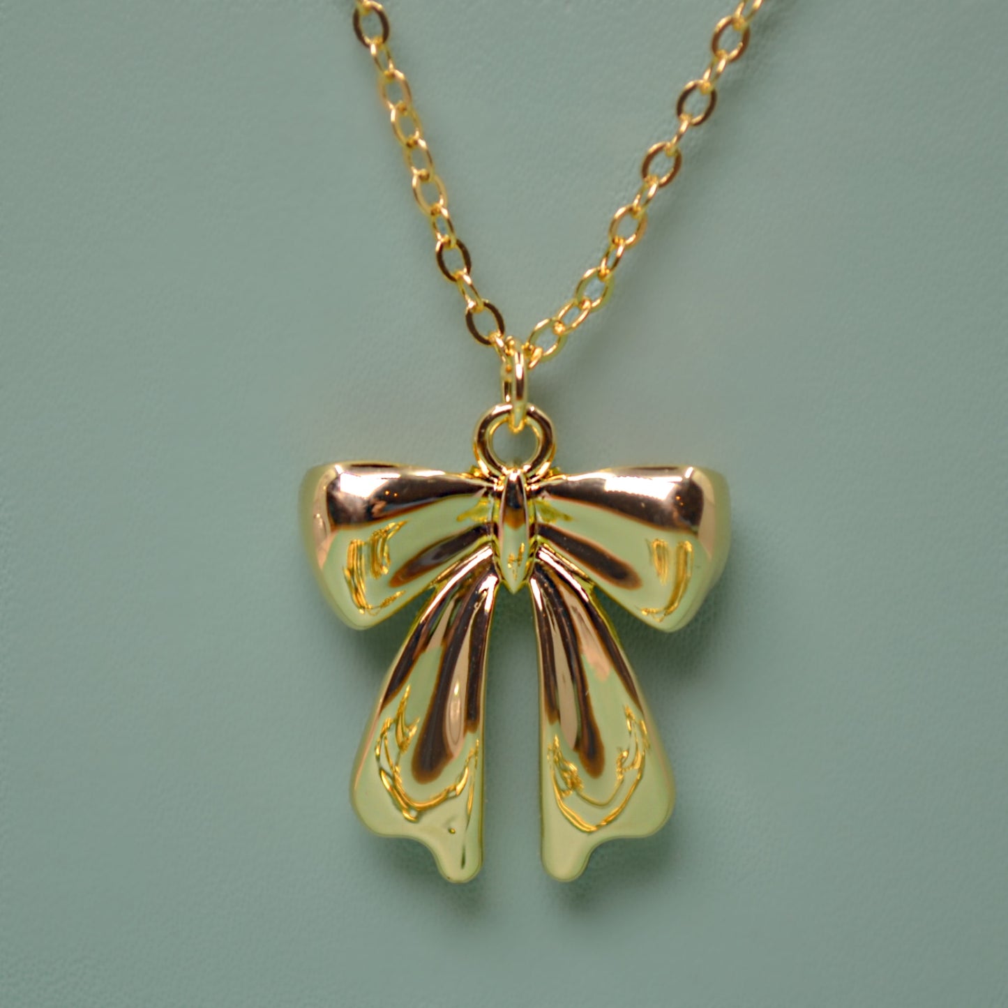 CLARA gold bow pendant and chain