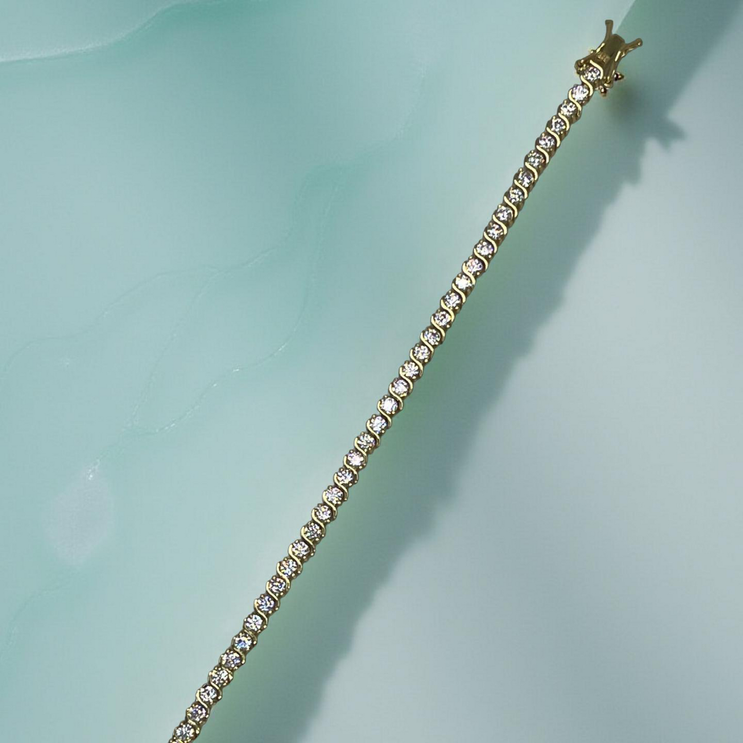 CURVE gold and cubic zirconia s-curve tennis bracelet