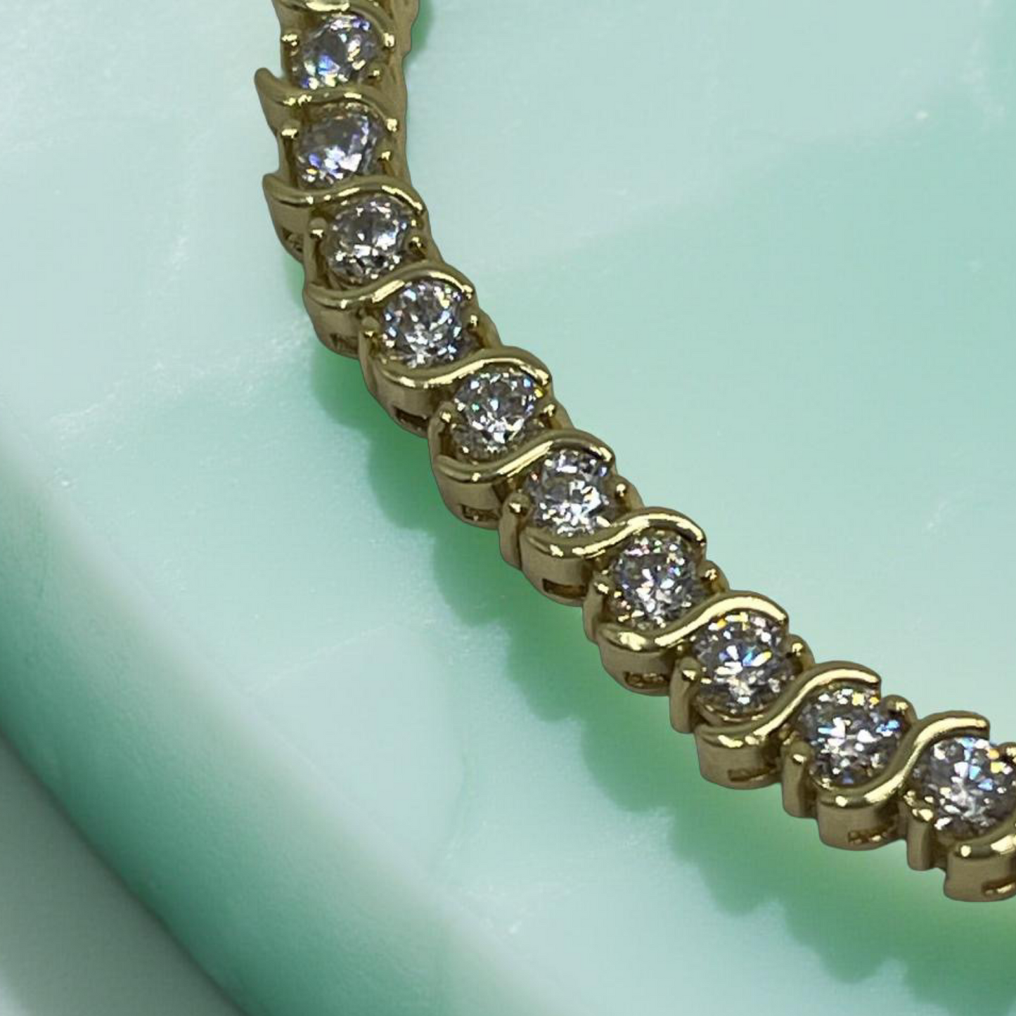 CURVE gold and cubic zirconia s-curve tennis bracelet