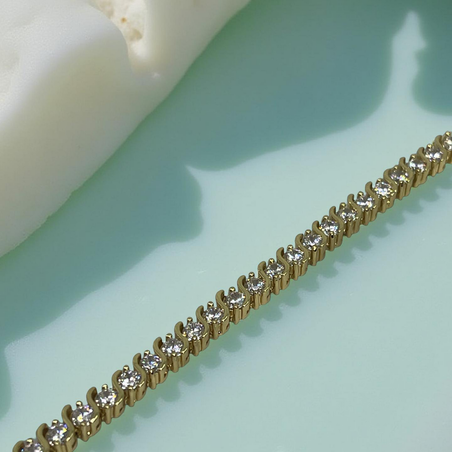 CURVE gold and cubic zirconia s-curve tennis bracelet