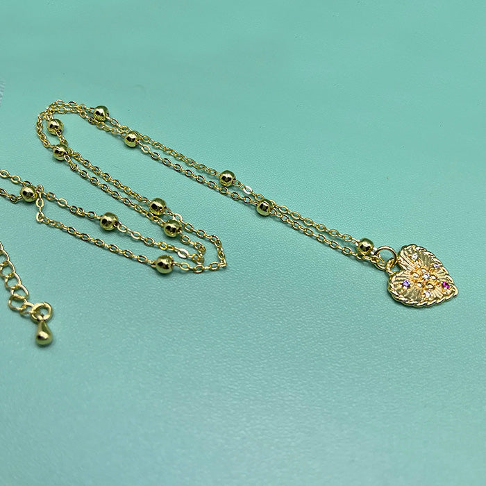 CELESTE gold heart pendant with gold bead chain