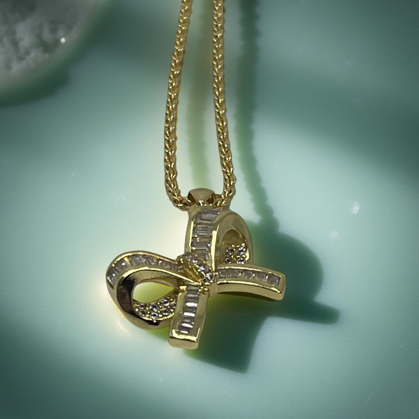LARA gold and pave baguette cz bow pendant