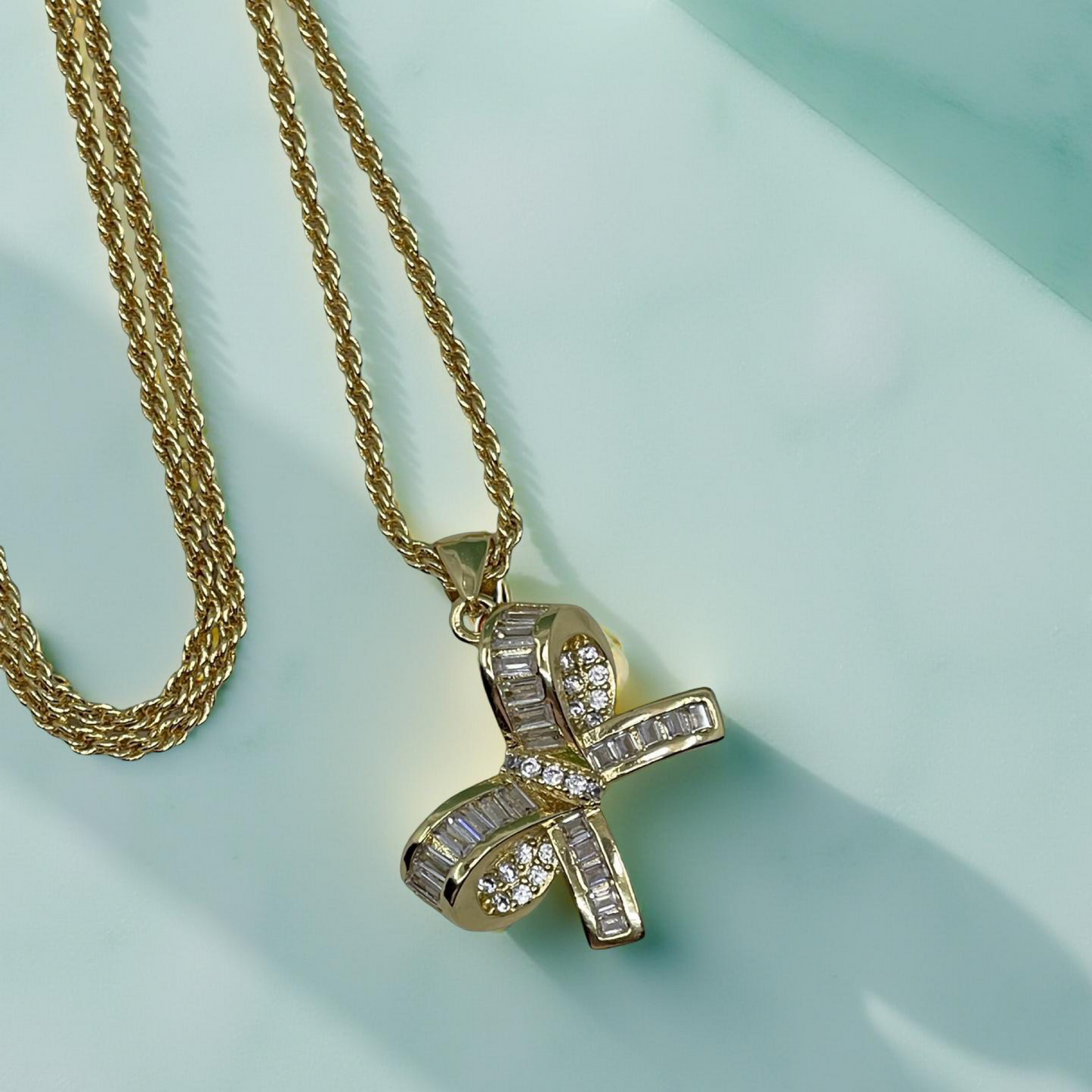 LARA gold and pave baguette cz bow pendant