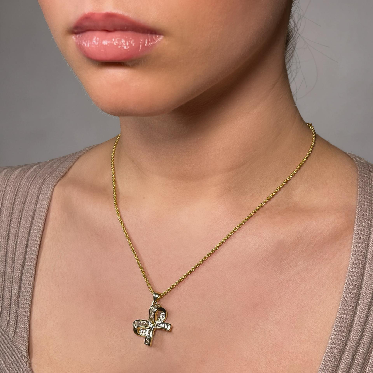 LARA gold and pave baguette cz bow pendant