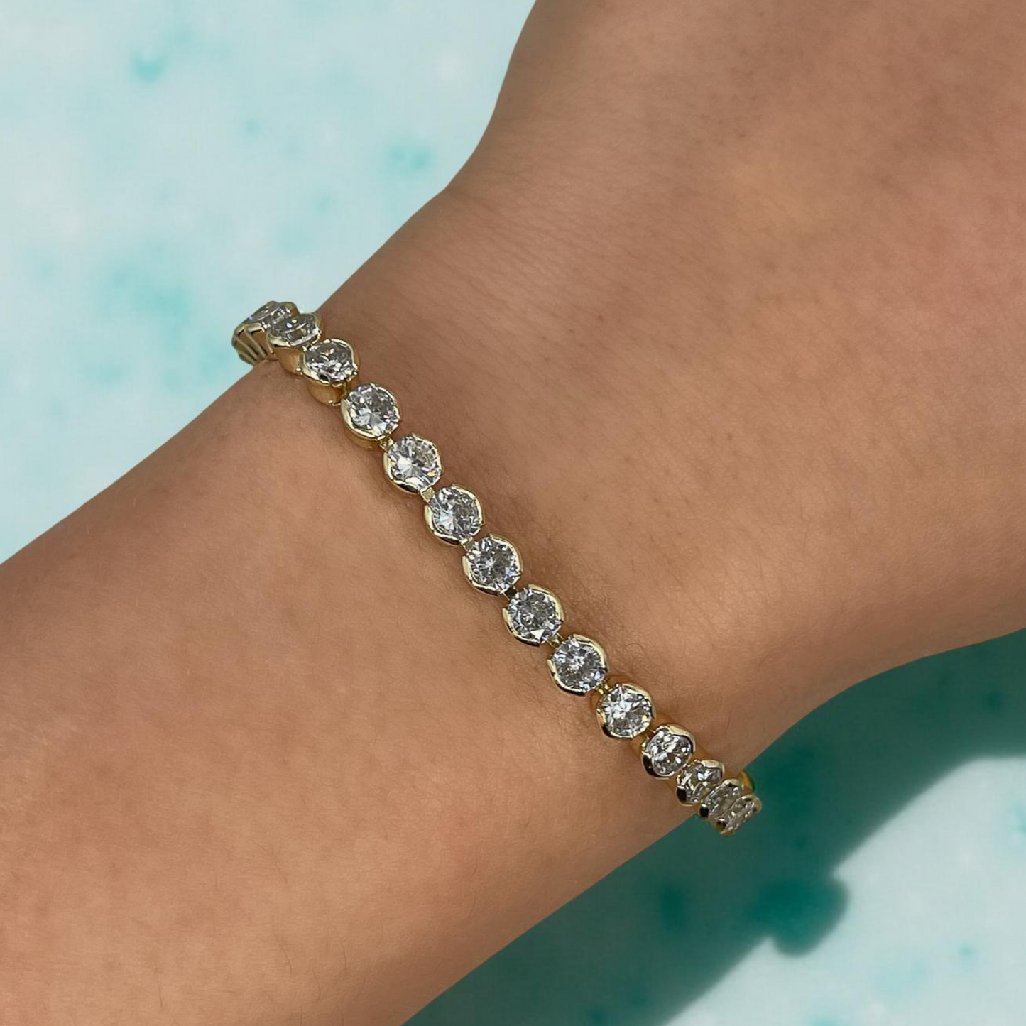 TONI gold and cz round bezel tennis bracelet