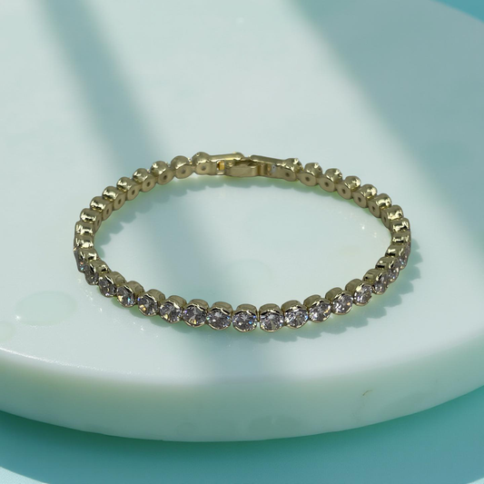 TONI gold and cz round bezel tennis bracelet