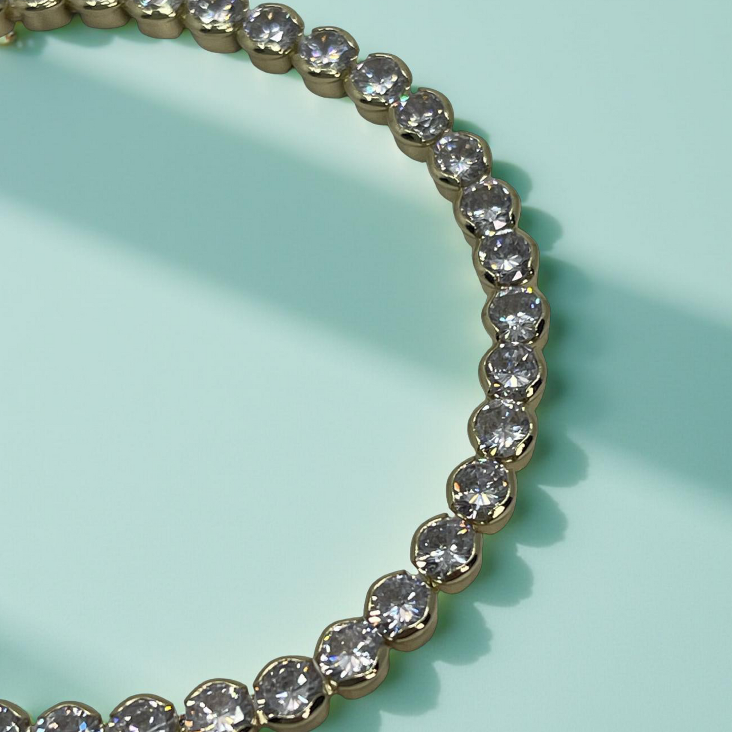 TONI gold and cz round bezel tennis bracelet