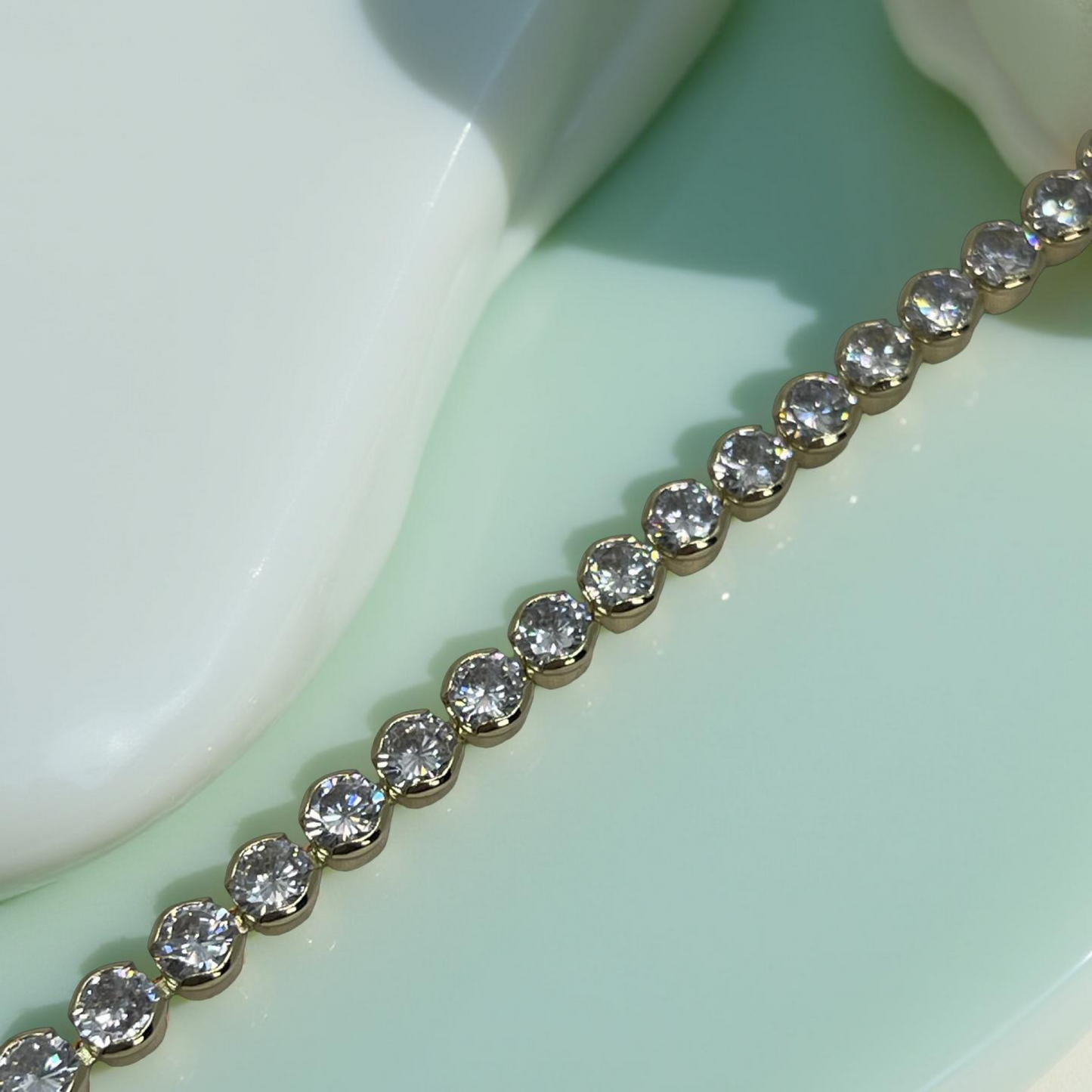 TONI gold and cz round bezel tennis bracelet